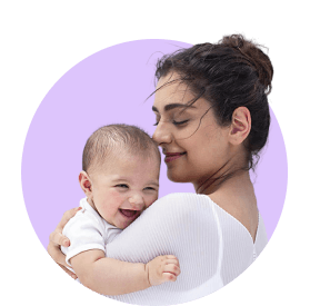 Mother holding a smiling baby